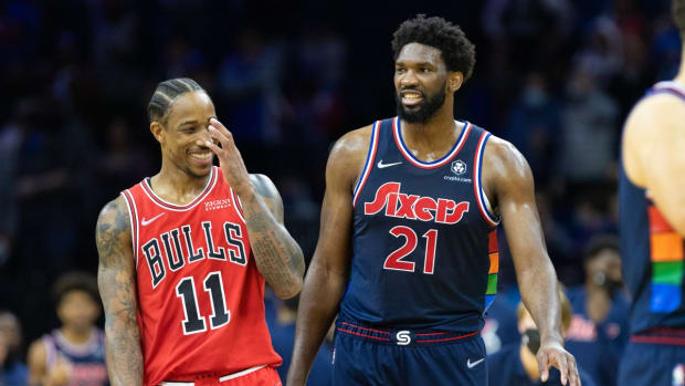 Nov 3, 2021; Philadelphia, Pennsylvania, USA; Philadelphia 76ers center Joel Embiid (21) reacts with Chicago Bulls forward DeMar DeRozan (11) after blocking his shot in the fourth quarter at Wells Fargo Center. Mandatory Credit: Bill Streicher-USA TODAY Sports
